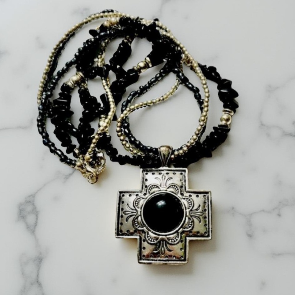 Cross Necklace with multi strands black precious stones and silver beads.
